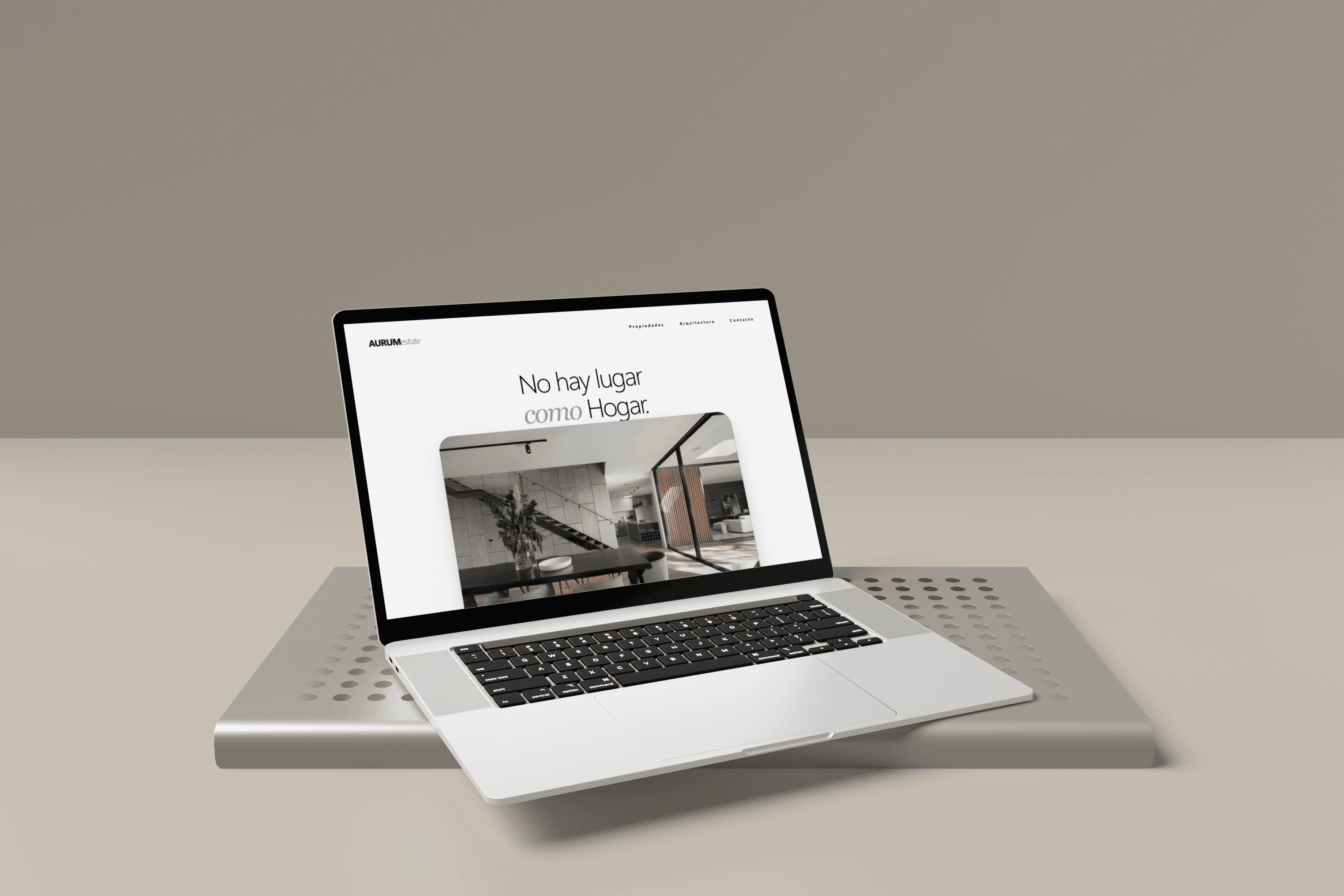 Laptop displaying the AURUM website in a minimalist setting.